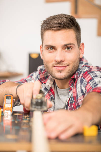 istock Man working on wood planks for home-improvement 857795632