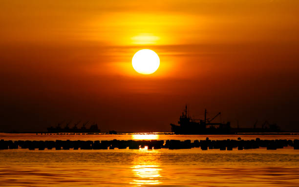 istock Nice boat silhouette at sea with sunset sky 857797826