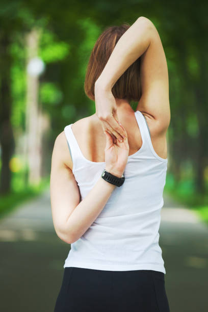 istock Young woman stretching in the park. 857797926