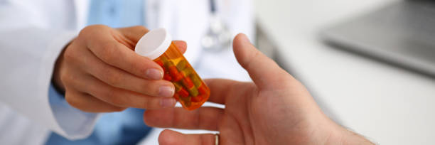 istock Female medicine doctor write prescription at worktable while 857799422