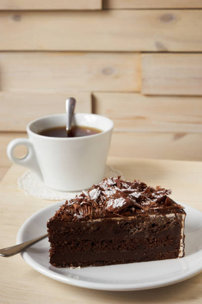 istock Slice of dark chocolate truffle cream cake 857799540