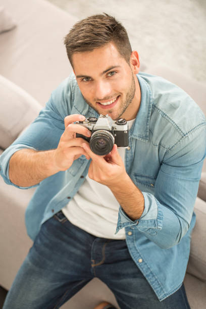 istock Student photography with a vntage camera 857799560
