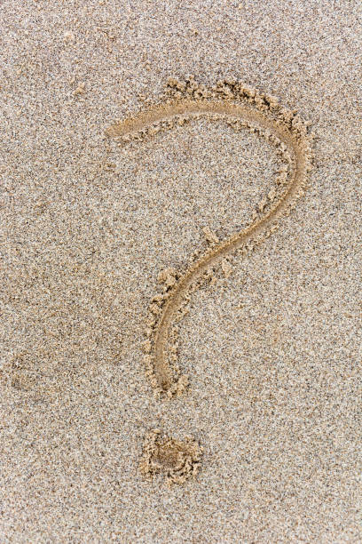istock A question mark drawn in the sand from above 857802260