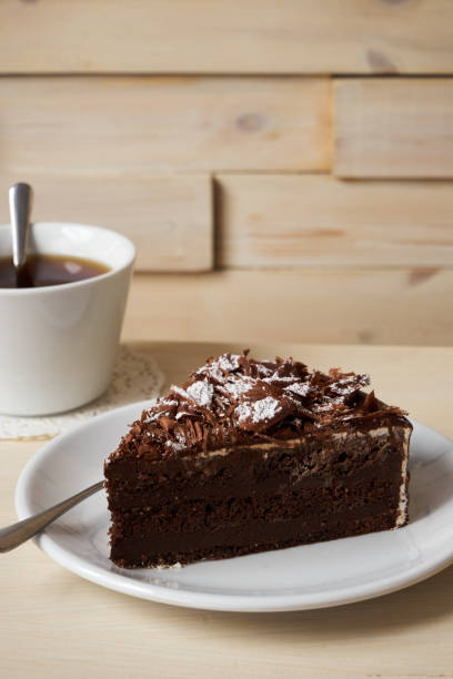 istock Slice of dark chocolate truffle cream cake 857803026
