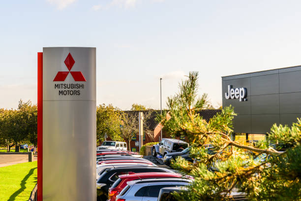 mitsubishi motors and jeep logo sign stand northampton industrial estate - editorial sports utility vehicle car jeep imagens e fotografias de stock