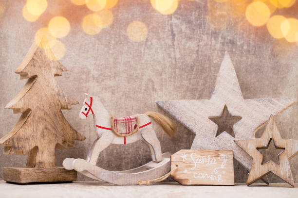 istock Christmas tree decorations on a wooden background. With bokeh ornaments. 857805962