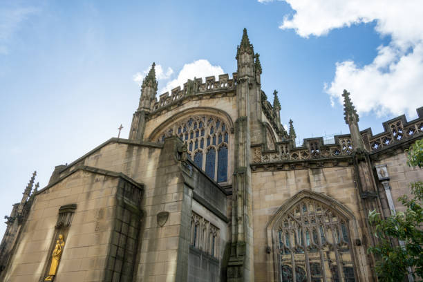 istock The cathedral of Manchester from the side with blue sky 857809542
