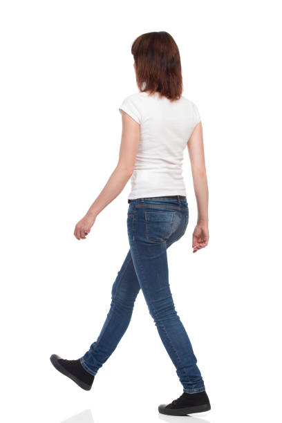 istock Walking Young Woman. Rear View Isolated 857813438