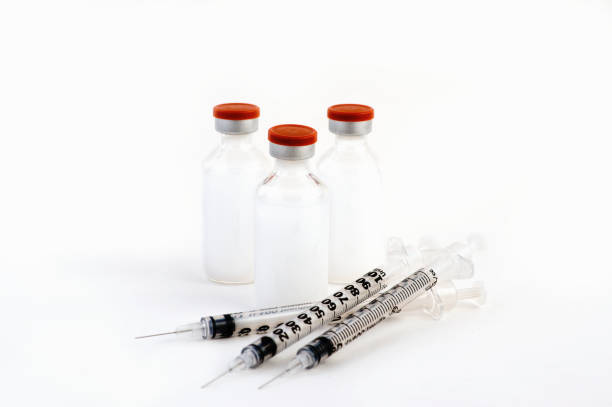 istock Insulin bottles and syringe 857813660