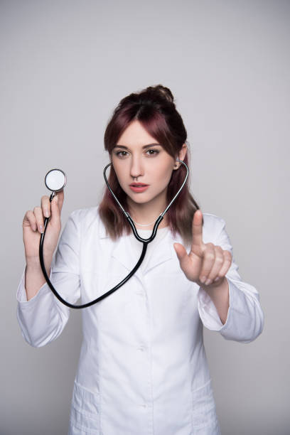 istock young female doctor holding stethoscope 857821770