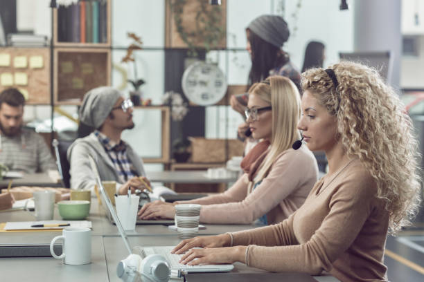 istock Young people working at call center 857822036