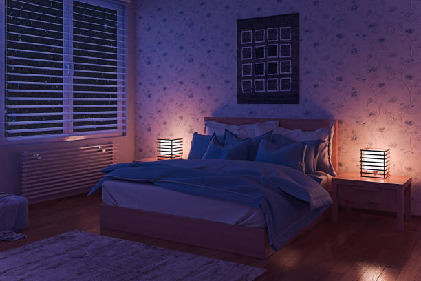 Cozy Bedroom at Night stock photo