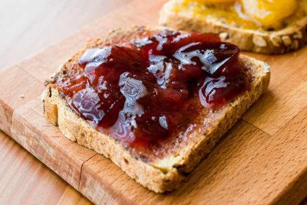 istock Damson Plum Jam on bread with Apricot jam 857824502