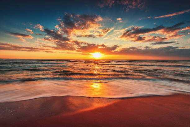 istock Beautiful cloudscape over the sea and warm sunrise 857828900