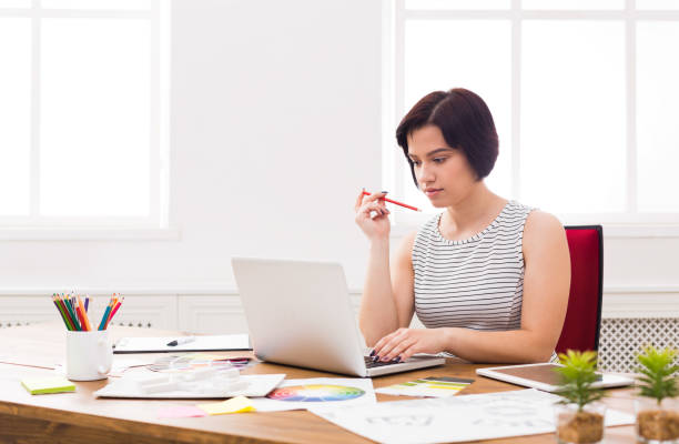 istock Business woman working on laptop at office 857831576