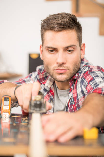 istock Man working on wood planks for home-improvement 857833170