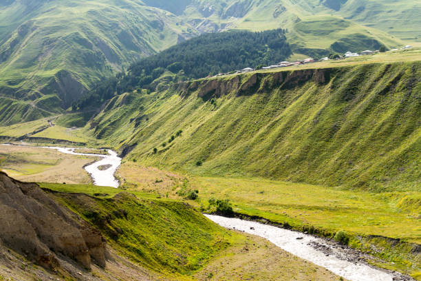 istock Mountain river dale between green hills in Caucasus mountains 857833878