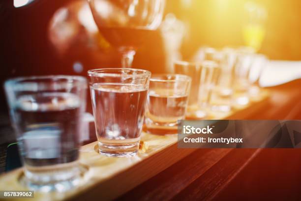 Close Up On Vodka Shots And Other Alcohols In A Row Stock Photo - Download Image Now