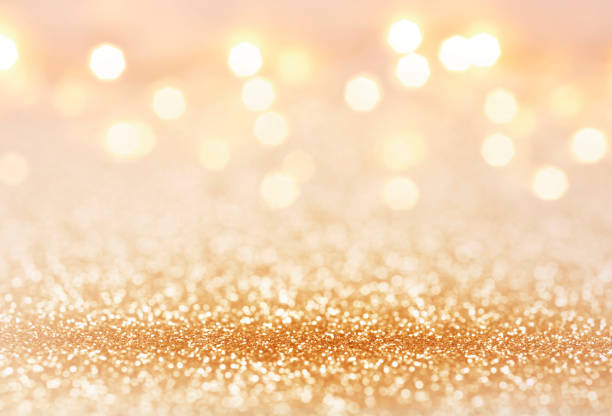 Golden color abstract glitter texture background for holidays