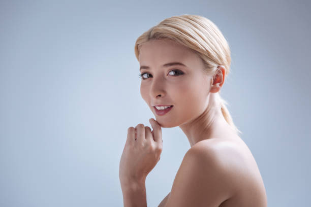 istock Cheerful girl touching her chin 857847998