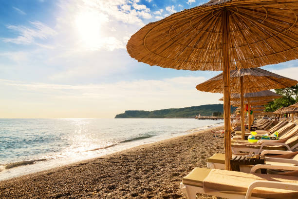 istock Beach chair and umbrella on the beach 857848278