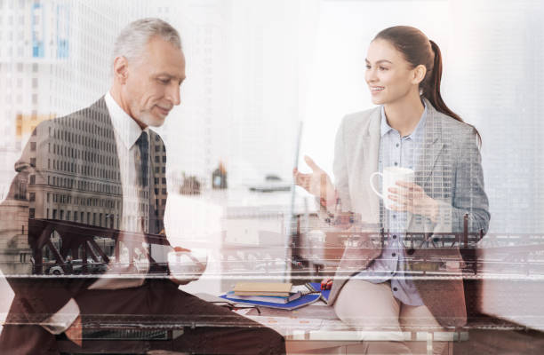 istock Positive businesspeople drinking coffee in the office 857850848