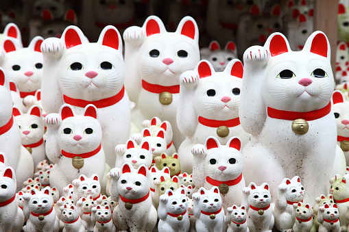 Tokyo, Japan- October 1, 2017: Gotokuji Temple is a Buddhist temple that is said to be the birthplace of the beckoning cat known as maneki neko. You can see these small statues, which portray a cat sitting up and beckoning with its front paw.