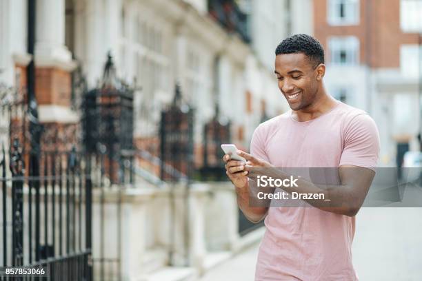 Handsome Black Guy In London Using Mobile Phone Stock Photo - Download Image Now - Men, Using Phone, Fashionable