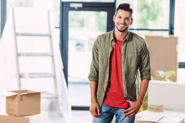 istock handsome man in new house 857853380
