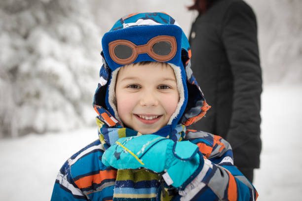 istock Happy little boy playing in snow 857853392