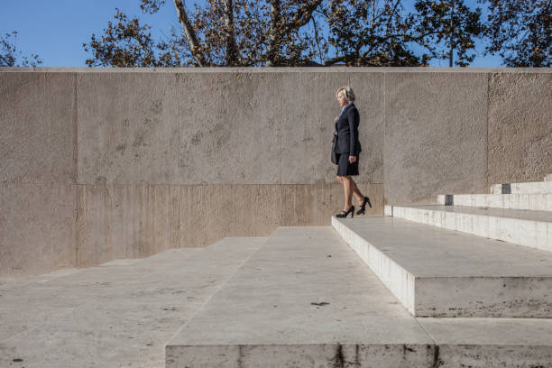 istock Professional woman walking through the stairs 857853736