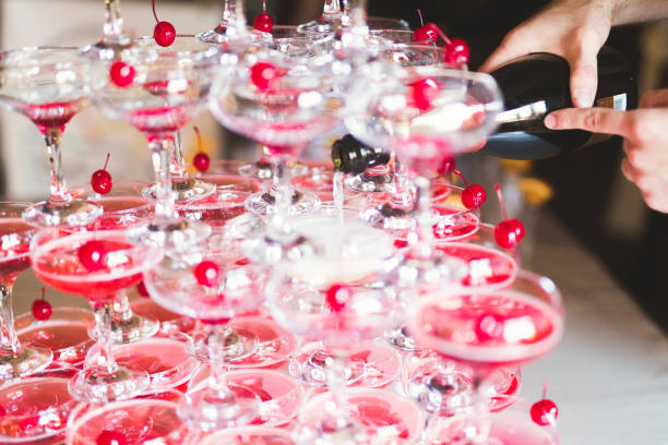 istock Waiter serving glasses with champagne on a tray 857854152