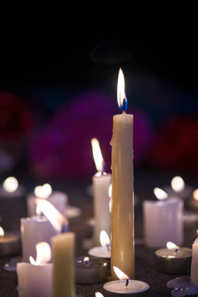 istock A makeshift memorial vigil with various size candles at night 857856556