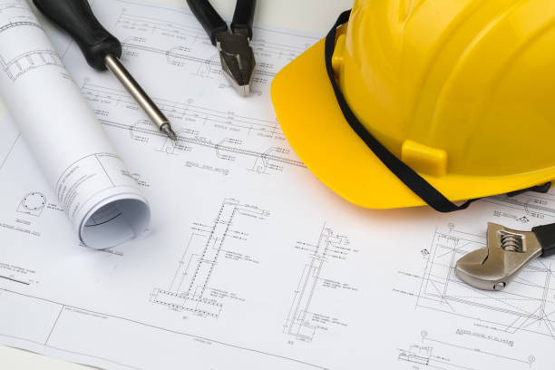 istock engineer construction business work concept : engineering blueprint diagrams paper drafting and industrial equipment 857856820