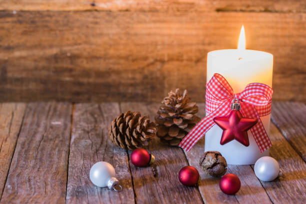 istock Christmas candlelight with traditional decorations 857860910