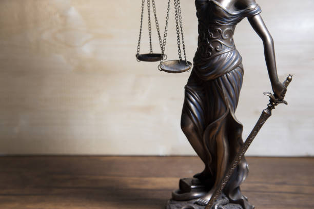 istock Scale of justice held by Lady Justice 857863558