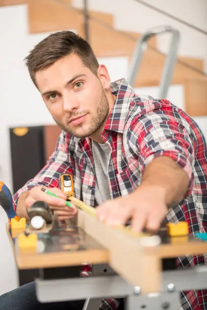 Man working on wood planks for home-improvement