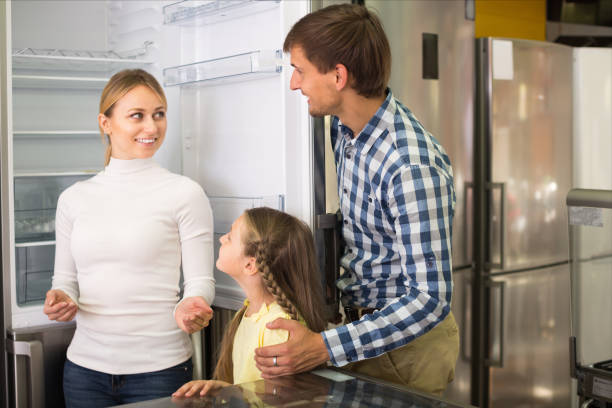 istock Smiling family with kid in store 857868772