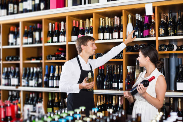 istock Seller helping to buy bottle 857868966