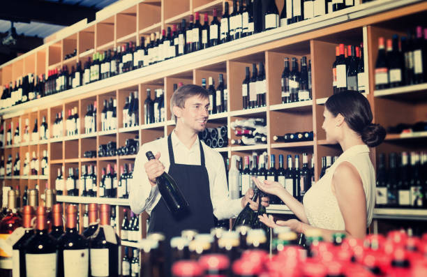 istock Seller helping to buy bottle 857868974
