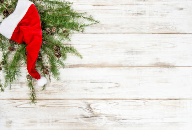 istock Red Santa Claus hat pine tree branches Christmas decoration 857870274