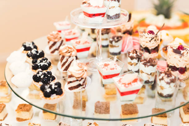 istock Delicious sweets on wedding candy buffet with desserts, cupcakes 857872970