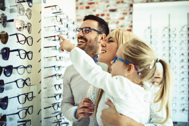 istock Family in optics store 857877250