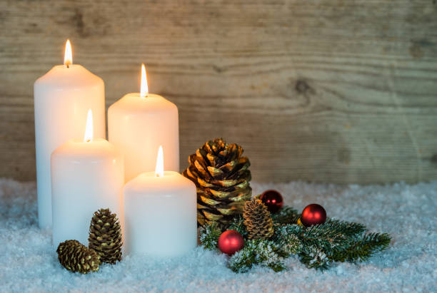 istock Festive burning white Christmas candles 857880422
