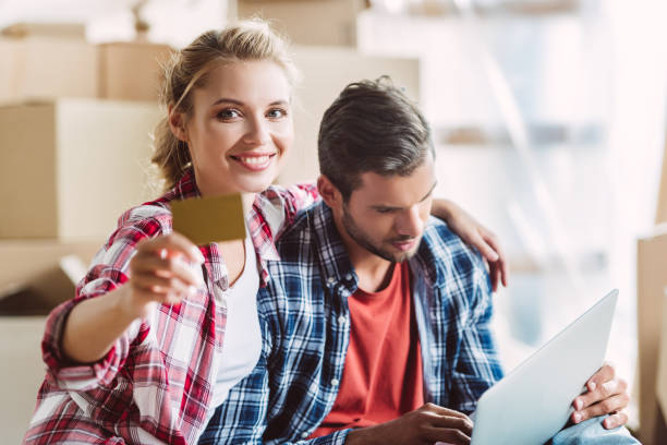 istock couple with laptop and credit card 857880994