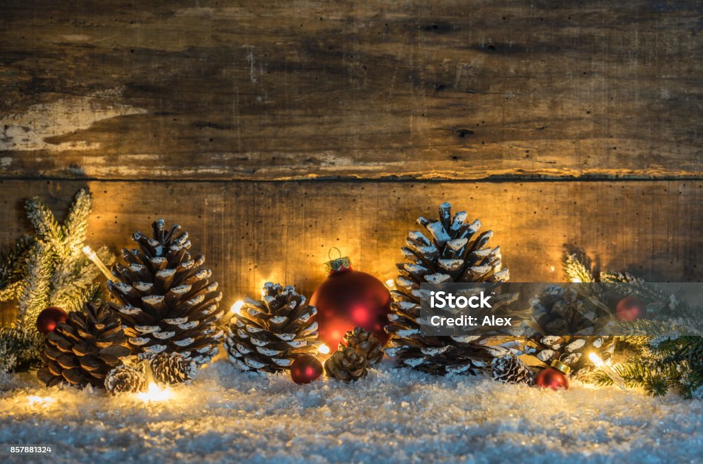 Rustic Christmas decoration with wooden background Christmas arrangement with natural ornaments, christmas balls and light. Christmas Stock Photo