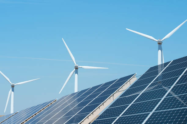 istock Wind turbines and solar panels with a clear blue sky 857884558