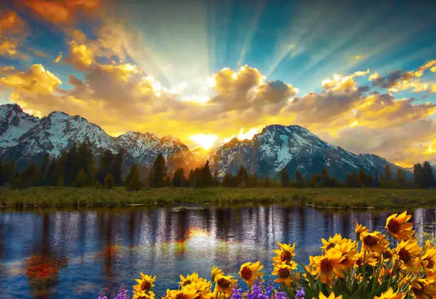 Panorama of the Grand Tetons with reflection in lake