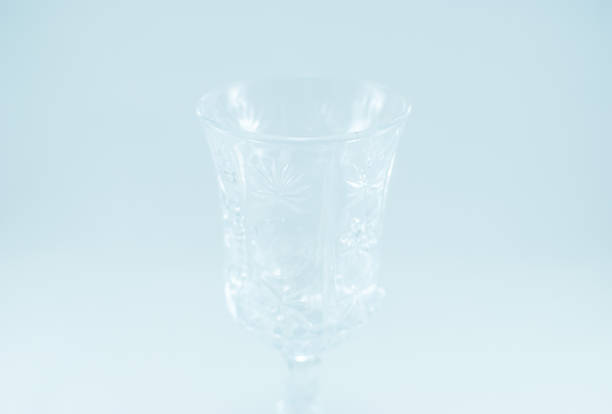 istock Closeup of a transparent engraved empty wine glass. 857885728