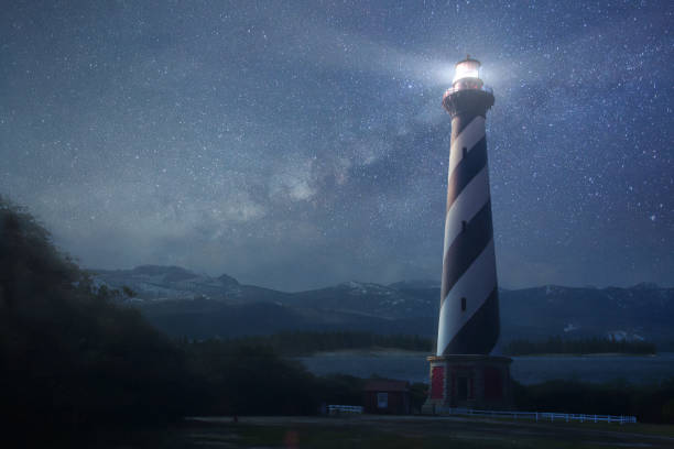 Lighthouse at night stock photo